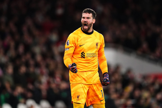 liverpool-goalkeeper-alisson-becker-celebrates-their-sides-first-goal-of-the-game-scored-by-arsenals-gabriel-not-pictured-via-an-own-goal-during-the-premier-league-match-at-emirates-stadium-lond