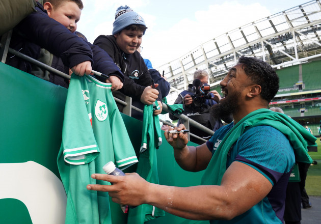 irelands-bundee-aki-signs-autographs-following-a-training-session-at-the-aviva-stadium-in-dublin-ireland-picture-date-thursday-february-29-2024