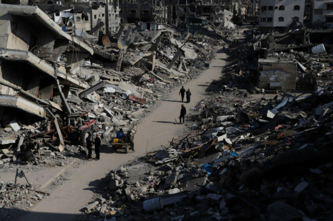 palestinians-walk-through-the-destruction-from-the-israeli-offensive-in-jabaliya-refugee-camp-in-the-gaza-strip-on-thursday-feb-29-2024-ap-photomahmoud-essa