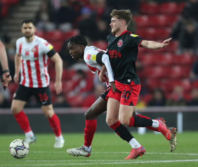 sunderlands-jay-matete-battles-with-fleetwood-towns-barry-baggley-during-the-sky-bet-league-1-match-between-sunderland-and-fleetwood-town-at-the-stadium-of-light-sunderland-on-tuesday-8th-march-202