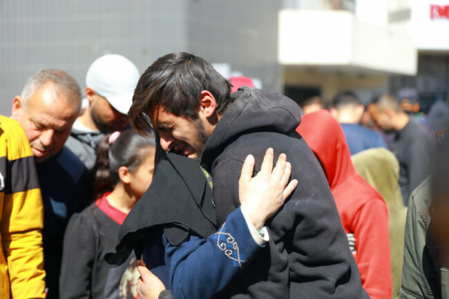 gaza-29th-feb-2024-people-comfort-each-other-as-they-mourn-victims-at-al-shifa-hospital-in-gaza-city-on-feb-29-2024-israeli-forces-opened-fire-thursday-on-a-crowd-of-palestinians-waiting-for-ai