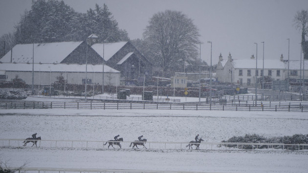 horses-on-the-gallops-at-the-curragh-racecourse-co-kildare-falling-sleet-and-snow-in-parts-of-ireland-have-led-to-some-travel-disruption-the-irish-weather-agency-met-eireann-issued-weather-warning