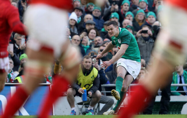 johnny-sexton-kicks-at-goal-as-richie-murphy-looks-on