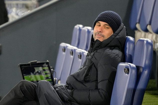 manchester-citys-head-coach-pep-guardiola-sits-prior-to-start-of-the-fa-cup-5th-round-soccer-match-between-luton-town-and-manchester-city-at-the-kenilworth-road-stadium-in-luton-england-tuesday-fe