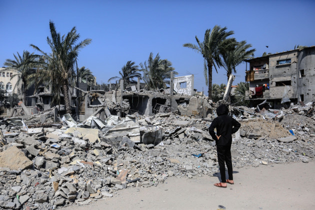 deir-al-balah-palestinian-territories-02nd-mar-2024-a-palestinian-child-inspects-the-damage-caused-by-an-israeli-air-strike-on-several-buildings-in-deir-al-balah-in-central-gaza-strip-credit-moh