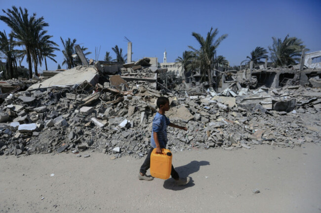 deir-al-balah-palestinian-territories-02nd-mar-2024-a-palestinian-child-inspects-the-damage-caused-by-an-israeli-air-strike-on-several-buildings-in-deir-al-balah-in-central-gaza-strip-credit-moh