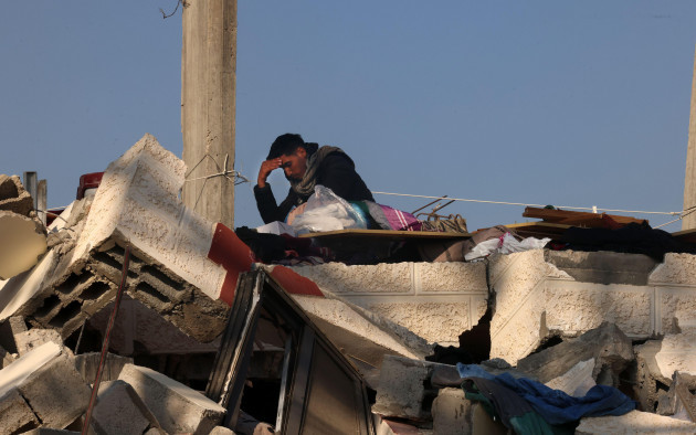 rafah-gaza-26th-feb-2024-palestinians-search-the-rubble-of-their-house-destroyed-in-an-overnight-israeli-air-strike-in-east-khan-yunis-in-the-southern-gaza-strip-on-monday-february-26-2024-cea