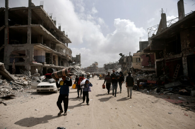 palestinians-carry-their-belonging-after-visiting-their-houses-destroyed-in-the-israeli-offensive-on-khan-younis-gaza-strip-wednesday-march-6-2024-ap-photomohammed-dahman