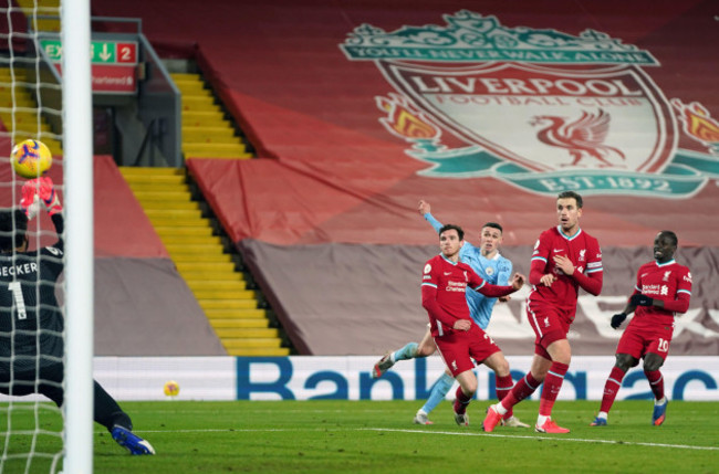 manchester-citys-phil-foden-scores-their-sides-fourth-goal-of-the-game-during-the-premier-league-match-at-anfield-liverpool-picture-date-sunday-february-7-2021