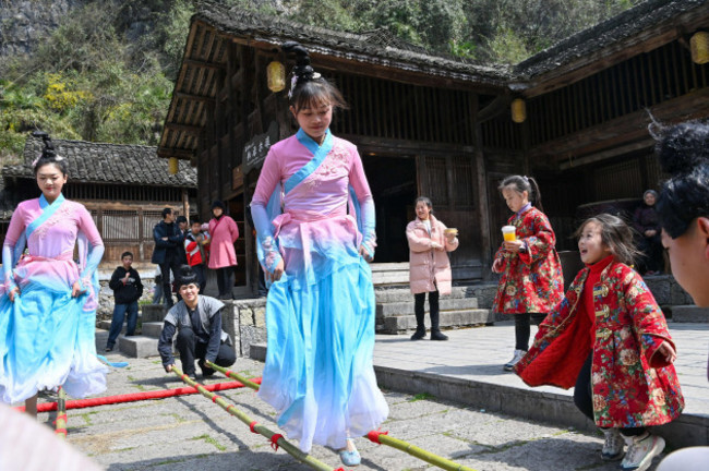 beijing-chinas-chongqing-municipality-8th-mar-2024-visitors-have-fun-at-a-scenic-spot-in-youyang-tujia-and-miao-autonomous-county-southwest-chinas-chongqing-municipality-march-8-2024-various