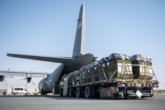 a-u-s-air-force-k-loader-filled-with-pallets-of-halal-meals-destined-for-an-airdrop-over-gaza-are-readied-for-load-onto-a-u-s-air-force-c-130j-super-hercules-at-an-undisclosed-location-in-the-u-s-c