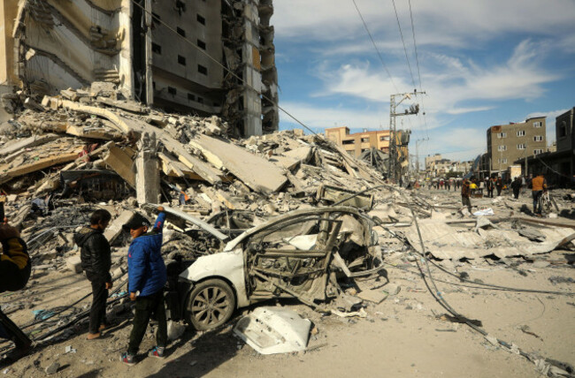 rafah-gaza-09th-mar-2024-young-palestinian-boys-stands-next-to-a-wrecked-car-in-the-rubble-of-a-residential-building-hit-in-an-overnight-israeli-air-strike-in-rafah-in-the-southern-gaza-strip-on