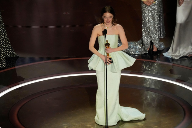 emma-stone-accepts-the-award-for-best-performance-by-an-actress-in-a-leading-role-for-poor-things-during-the-oscars-on-sunday-march-10-2024-at-the-dolby-theatre-in-los-angeles-ap-photochris-pi
