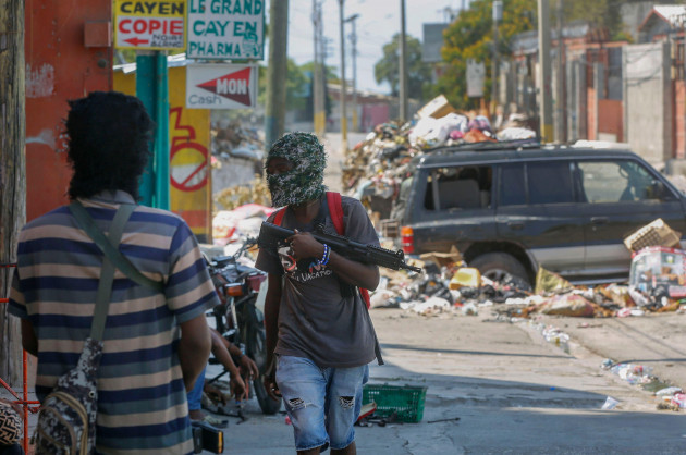 armed-members-of-the-g9-and-family-gang-stand-guard-at-their-roadblock-in-the-delmas-6-neighborhood-of-port-au-prince-haiti-monday-march-11-2024-ap-photoodelyn-joseph