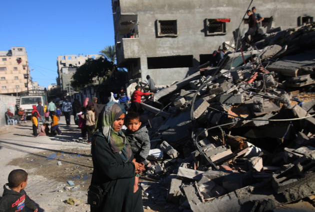 gaza-12th-mar-2024-people-gather-at-a-destroyed-building-in-the-southern-gaza-strip-city-of-rafah-on-march-12-2024-the-palestinian-death-toll-due-to-the-ongoing-israeli-attacks-on-the-gaza-strip
