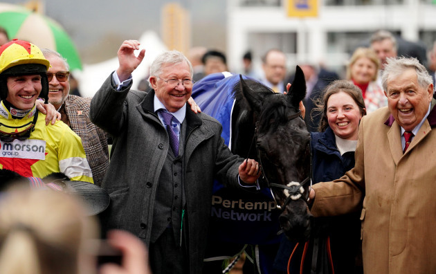 sir-alex-ferguson-centre-owner-of-monmiral-celebrates-after-watching-his-horse-win-the-pertemps-network-final-which-was-ridden-to-victory-by-harry-cobden-left-on-day-three-of-the-2024-cheltenham