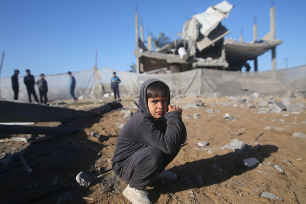 gaza-15th-mar-2024-a-boy-squats-in-front-of-a-destroyed-building-in-the-southern-gaza-strip-city-of-rafah-on-march-15-2024-the-palestinian-death-toll-in-the-gaza-strip-from-ongoing-israeli-attac