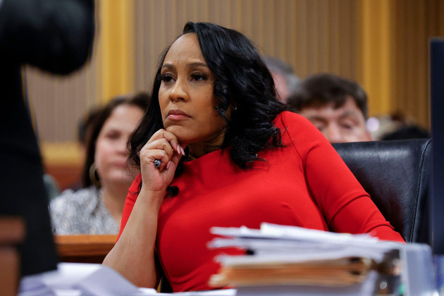 fulton-county-district-attorney-fani-willis-looks-on-during-a-hearing-on-the-georgia-election-interference-case-friday-march-1-2024-in-atlanta-the-hearing-is-to-determine-whether-fulton-county-d