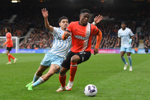 morgan-gibbs-white-of-nottingham-forest-puts-pressure-on-chiedozie-ogbene-of-luton-town-during-the-premier-league-match-between-luton-town-and-nottingham-forest-at-kenilworth-road-luton-on-saturday-1