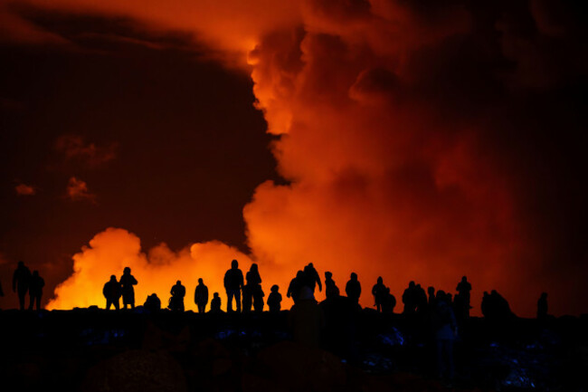 spectators-watch-plumes-of-smoke-from-volcanic-activity-between-hagafell-and-stori-skogfell-iceland-saturday-march-16-2024-ap-photomarco-di-marco