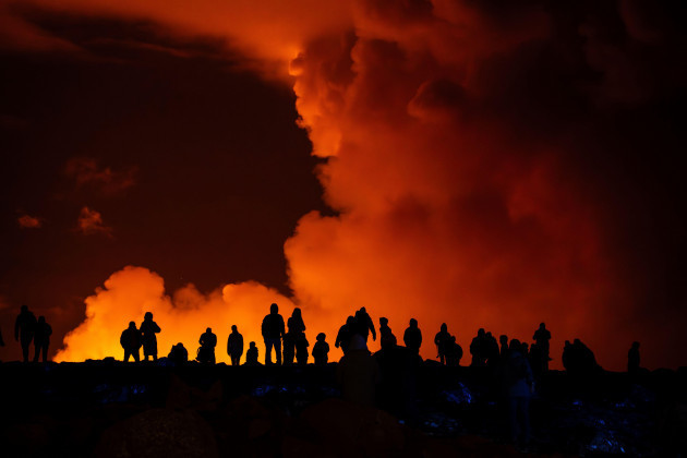 spectators-watch-plumes-of-smoke-from-volcanic-activity-between-hagafell-and-stori-skogfell-iceland-saturday-march-16-2024-ap-photomarco-di-marco