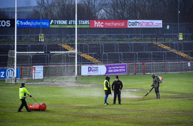 groundskeepers-work-on-the-pitch-before-the-game
