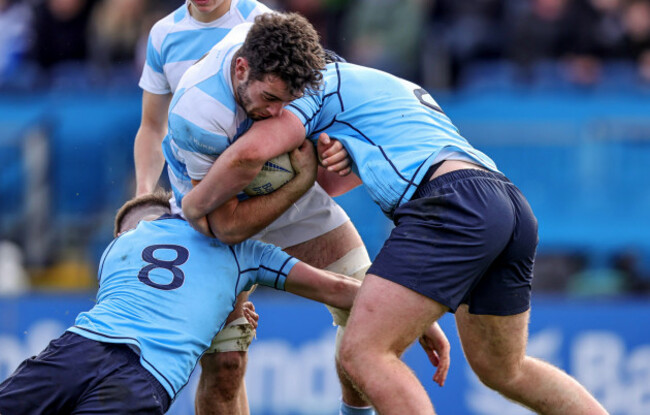 mark-walsh-is-tackled-by-sam-corrigan-and-duinn-maguire