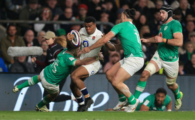 immanuel-feyi-waboso-is-tackled-by-hugo-keenan-and-james-lowe