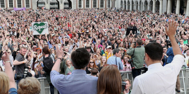 health-minister-simon-harris-left-and-taoiseach-leo-varadkar-right-wave-at-crowds-as-they-celebrate-at-dublin-castle-after-the-results-of-the-referendum-on-the-8th-amendment-of-the-irish-constitut