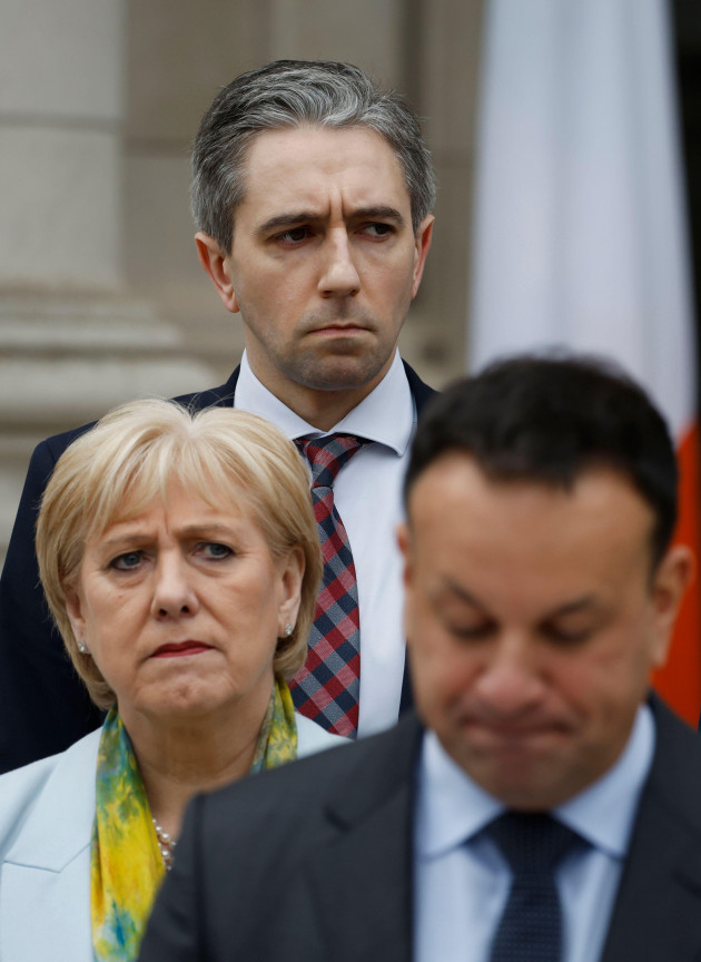 taoiseach-leo-varadkar-front-speaking-to-the-media-at-government-buildings-in-dublin-he-has-announced-he-is-to-step-down-as-taoiseach-and-as-leader-of-his-party-fine-gael-with-party-colleagues-fr