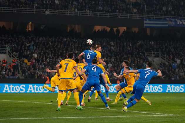 greeces-dimitris-kourbelis-centre-number-six-jumps-for-a-header-to-score-his-side-forth-goal-against-kazakstan-during-the-euro-2024-qualifying-play-off-soccer-match-between-greece-and-kazakhstan-at
