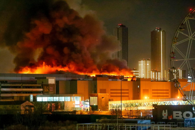 a-massive-blaze-is-seen-over-the-crocus-city-hall-on-the-western-edge-of-moscow-russia-friday-march-22-2024-several-gunmen-have-burst-into-a-big-concert-hall-in-moscow-and-fired-automatic-weapons