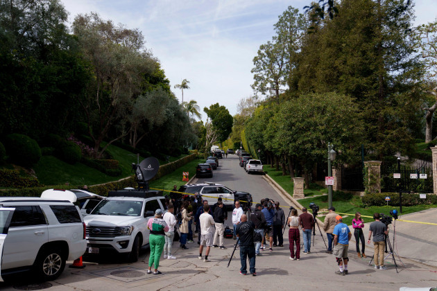 media-gathers-as-law-enforcement-blocks-a-street-in-front-of-a-property-belonging-to-sean-diddy-combs-on-monday-march-25-2024-in-los-angeles-two-properties-belonging-to-combs-in-los-angeles-and
