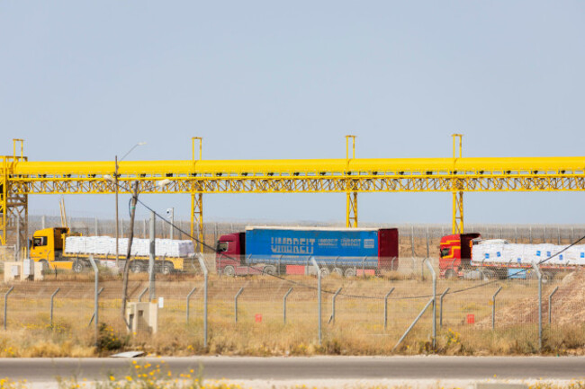 kerem-shalom-israel-26th-mar-2024-egyptian-trucks-carrying-aid-supplies-wait-on-the-israeli-side-of-the-kerem-shalom-border-crossing-to-continue-their-journey-to-the-gaza-strip-aid-supplies-are-t