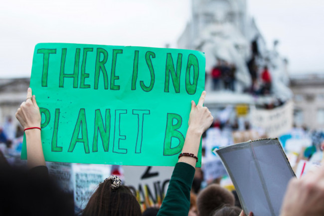 people-with-banners-protest-as-part-of-a-climate-change-march