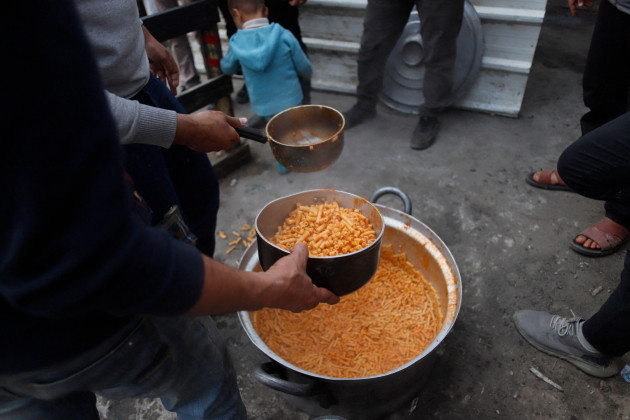 rafah-on-march-21-2024-people-gather-to-get-food-relief-in-the-southern-gaza-strip-city-of-rafah-on-march-21-2024-the-people-of-gaza-are-enduring-catastrophic-levels-of-hunger-and-famine-is-i