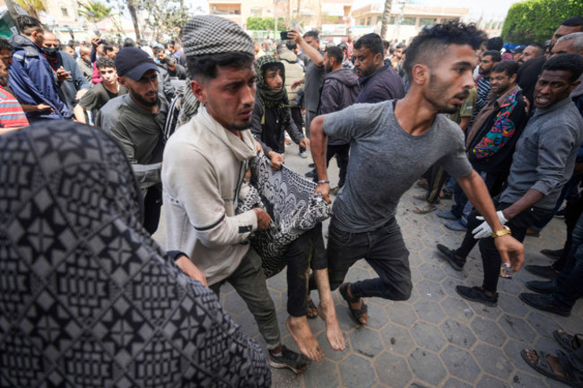 palestinians-carry-a-wounded-person-following-an-israeli-airstrike-near-the-al-aqsa-hospital-in-deir-al-balah-gaza-strip-sunday-march-31-2024-ap-photoabdel-kareem-hana