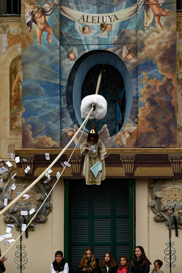 young-girl-nadie-pardo-secured-by-a-harness-floats-in-the-air-during-the-easter-sunday-ceremony-descent-of-the-angel-part-of-holy-week-in-tudela-northern-spain-sunday-march-31-2024-ap-ph