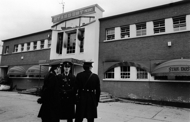 police-stand-outside-the-main-entrance-of-a-fire-blackened-stardust-disco-in-ardane-dublin-where-in-the-early-hours-49-youngsters-perished-in-a-fire-more-than-130-others-were-injured-arson-may-hav