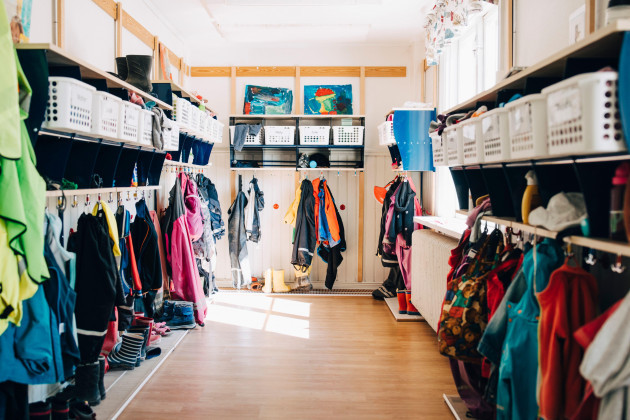 various-clothes-hanging-in-cloakroom-at-preschool
