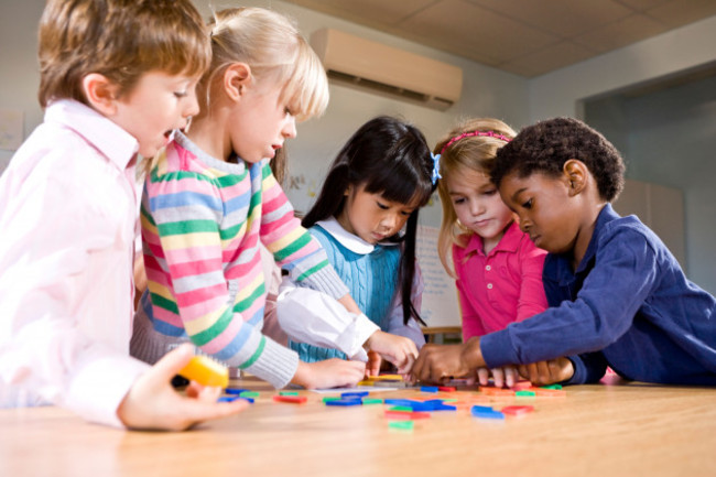 preschool-children-working-together-on-puzzle