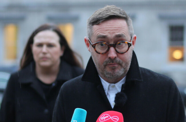 sinn-fin-politicians-eoin-broin-right-speaks-to-the-media-as-louise-oreilly-left-looks-on-at-the-plinth-at-leinster-house-dublin-regarding-the-tanaiste-leo-varadkars-decision-to-leak-co
