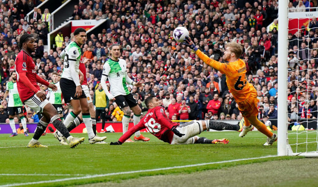 manchester-uk-7th-apr-2024-caoimhin-kelleher-of-liverpool-r-saves-from-casemiro-of-manchester-united-during-the-premier-league-match-at-old-trafford-manchester-picture-credit-should-read-andr