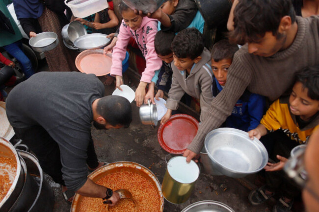 rafah-on-march-21-2024-people-gather-to-get-food-relief-in-the-southern-gaza-strip-city-of-rafah-on-march-21-2024-the-people-of-gaza-are-enduring-catastrophic-levels-of-hunger-and-famine-is-i