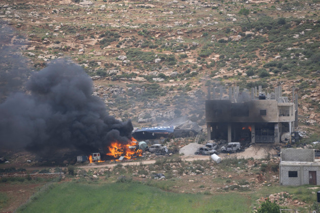 properties-of-palestinian-villagers-are-set-on-fire-by-israeli-settlers-in-the-west-bank-village-of-al-mughayyir-saturday-april-13-2024-israels-army-says-the-body-of-a-missing-israeli-teen-has-be