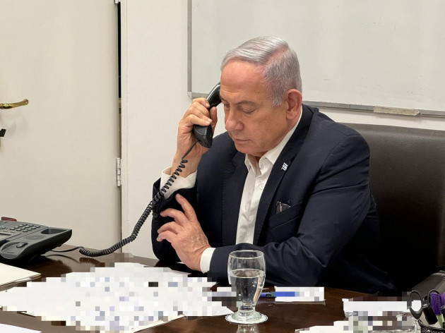 240414-tel-aviv-april-14-2024-xinhua-this-photo-released-on-april-14-2024-shows-israeli-prime-minister-benjamin-netanyahu-making-a-phone-call-with-u-s-president-joe-biden-u-s-president