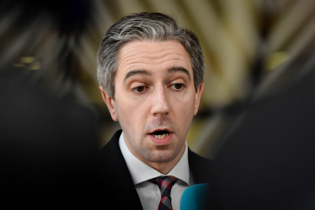 irelands-prime-minister-simon-harris-speaks-with-the-media-as-he-arrives-for-an-eu-summit-in-brussels-thursday-april-18-2024-european-union-leaders-vowed-on-wednesday-to-ramp-up-sanctions-against