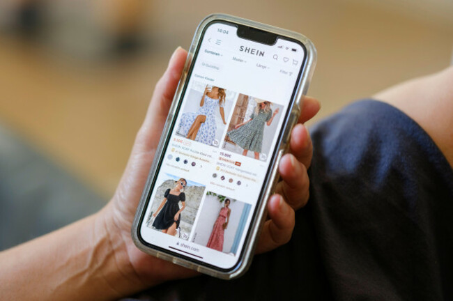a-woman-visits-the-website-of-the-chinese-fashion-giant-shein-on-her-mobile-phone