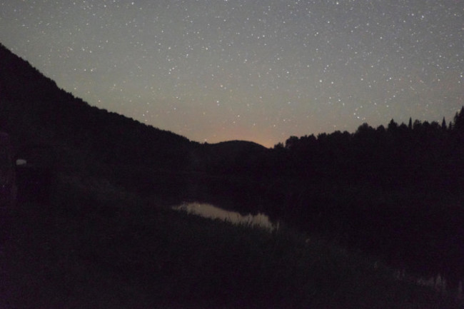 starry-night-sky-above-silhouette-of-mountains-ural-russia