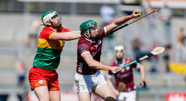 cathal-mannion-gets-to-the-ball-ahead-of-paul-doyle